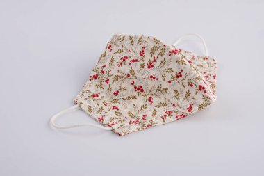 Close-up handmade face mask made from plaid cloth.