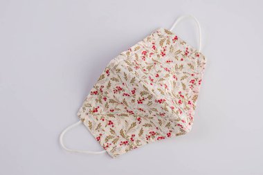 Close-up handmade face mask made from plaid cloth.