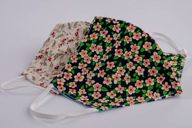 Close-up handmade face mask made from plaid cloth.