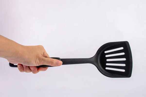 Hand Plastic Black Spatula Frying Pan Isolated White Background — Fotografia de Stock