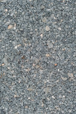 White crushed stones texture background. Gray rubble construction rock pebble pattern. 