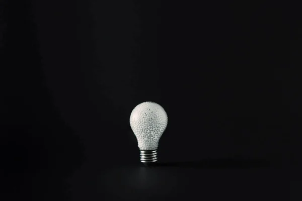 Light Bulb Filled White Styrofoam Beads Black Background Minimal Concept — Stock Photo, Image