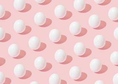 Paskalya arkaplan desenli, pembe arka planda beyaz yumurtalar. Asgari konsept.