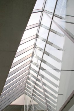 Interior view of a building with reflective window, modern architecture white color