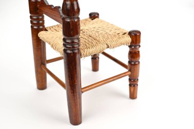 Looking at the small chair diagonally from behind