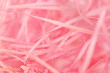 The pieces of wood are colored and pink.