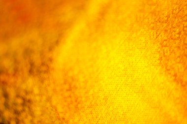 Bulanık altın arkaplan ve küçük bir alan derinliği. Dairesel bokeh arkaplanı.