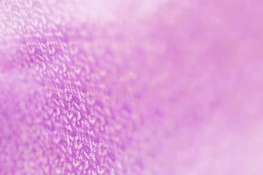 Küçük bir alan derinliği olan soyut, bulanık, pembe bir arka plan. Dairesel bokeh arkaplanı.