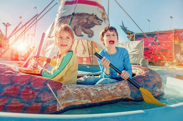 Children Having Fun Amusement Park Ride Canoe Happy Childhood Concept — Stock Photo, Image