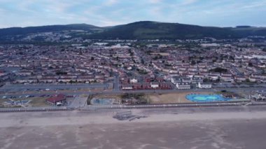A drone view of Aberavon Beach and the Sandfields Estate in Port Talbot UK.