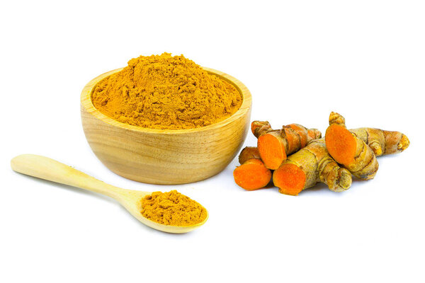 Turmeric powder and turmeric isolated on white background.