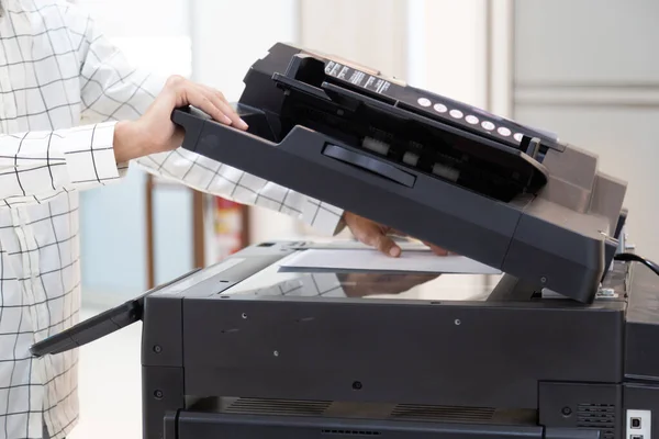 Businessman press button on panel of printer photocopier  network , Working on photocopies in the office concept , printer is office worker tool equipment for scanning and copy paper.