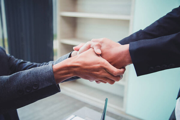 Concept of partnership - handshake business partners Successful team leader entrepreneurship .