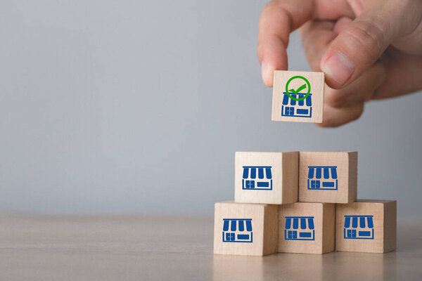 Franchise business concept,hand choose wood blog with franchise marketing.