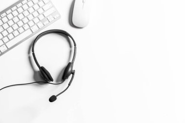 Headset and customer support equipment at call center ready for actively service , Communication support, call center and customer service help desk.for (call center) concept .