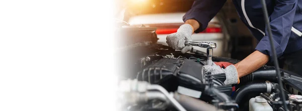 Automobile mechanic repairman hands repairing a car engine automotive workshop with a wrench, car service and maintenance, Repair service.