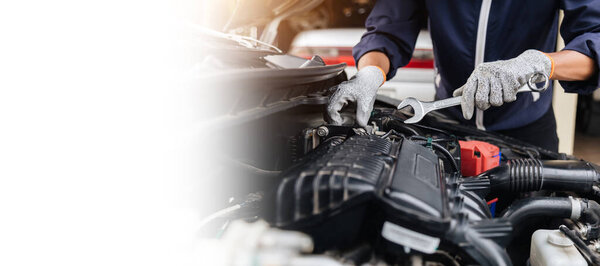 Automobile mechanic repairman hands repairing a car engine automotive workshop with a wrench, car service and maintenance, Repair service.