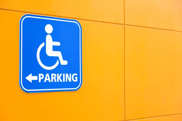 Blue handicap parking or wheelchair parking space sign