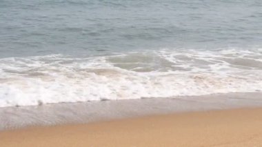 The beach wave and the beautiful beach will rise above the sea wave