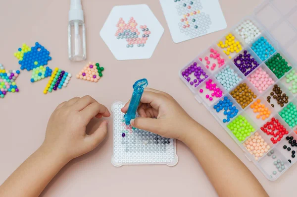 Children Educational Game Aqua Mosaic Small Child Inserts Multicolored Beads — Stock Photo, Image