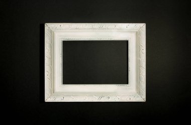 White square vintage picture frame, on black background.