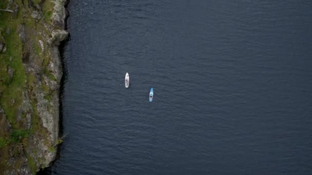 Drone shot on two people on SUP board in norway — Stockvideo