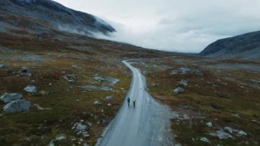 Epic drone shot of young cyclists enjoying ride