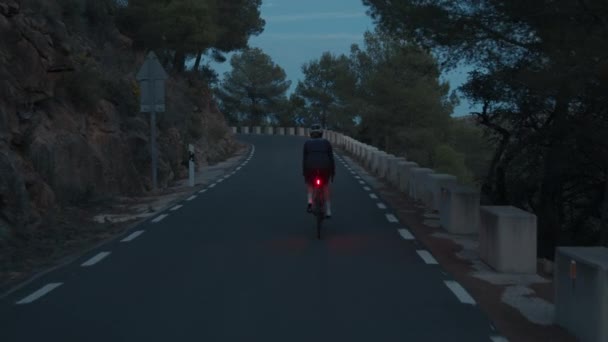 Back View Professional Road Cyclist Young Woman Rides Bike Lights — Stock Video