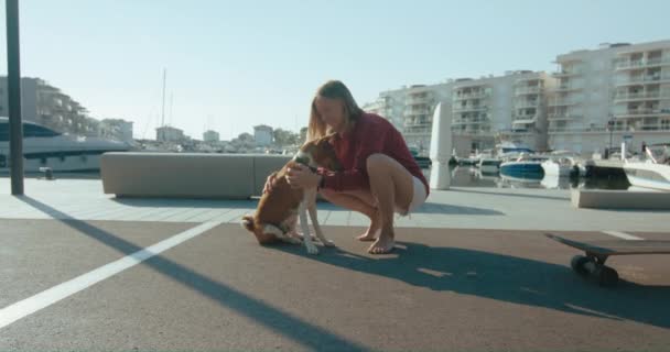 Happy Young Female Pet Owner Scratches Kisses Cute Basenji Dog — Stok video