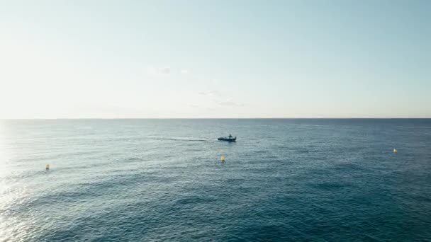 Dolly Zoom Small Lonely Fish Trawler Passing Calm Blue Sea — Stock Video