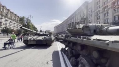 Khreschatyk street, exposition of captured, destroyed and burnt russian military equipment, artillery and tanks. Passers by look at war crimes proof. Independence day. KYIV, UKRAINE - 24 AUGUST 2022