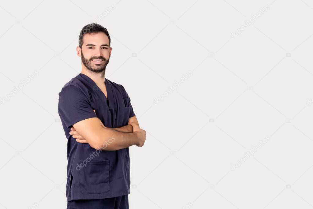 Bearded physiotherapist posing smiling with arms folded