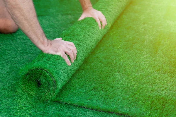 Selective Focus Man Hands Unrolling Roll Artificial Turf Easy Laying — 图库照片