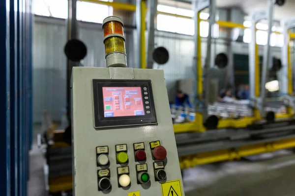 Factory for the production of double-glazed windows made of sheet glass. Sheet glass in pallets near the sheet glass cutting line.