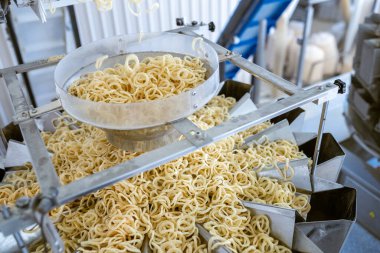 sorting and packing line of snack onion ring at factory conveyor for cereal snack production of flour products, technology production in food Industry