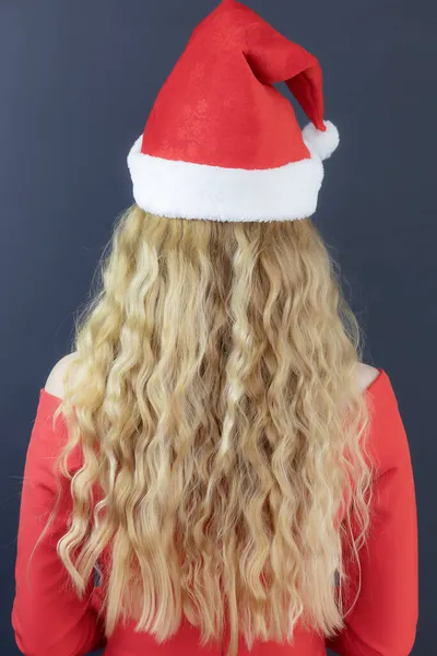 Lady santa with long wavy hair. Back view. Santa blonde. Festive poster. — Stock Photo, Image