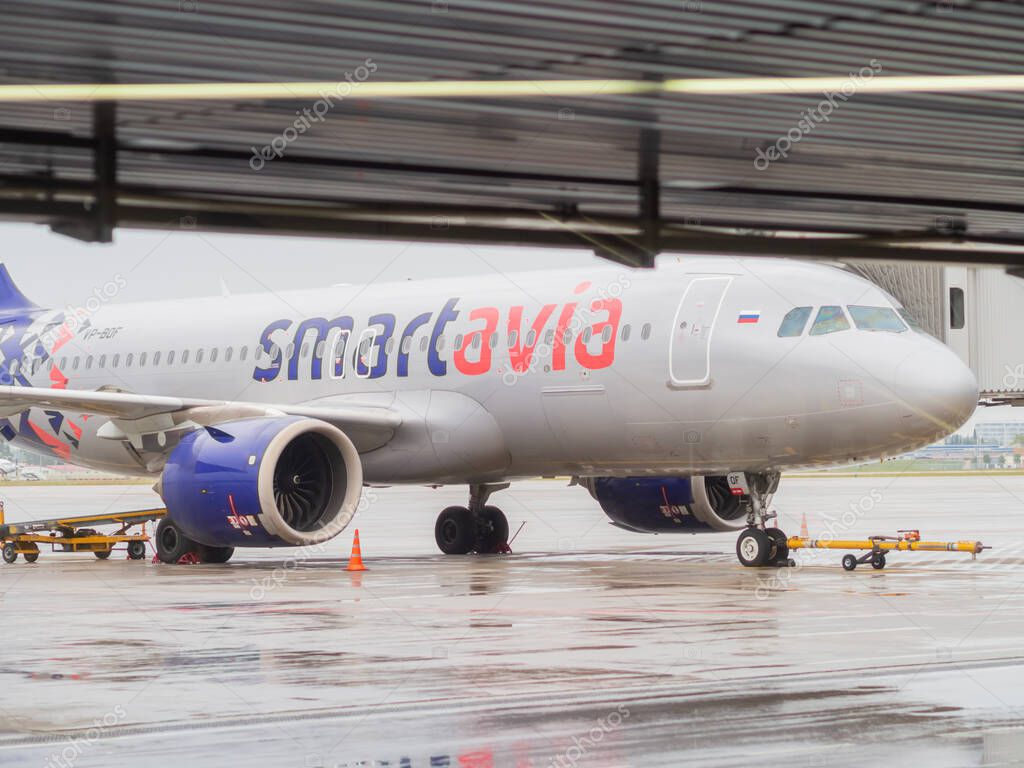 Russia, Sochi 02.11.2021. An airliner with the inscription smartavia stands on the runway on rainy day. Non-flying weather