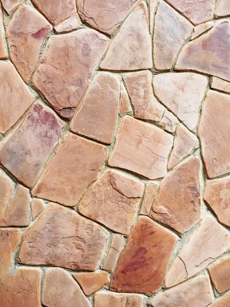 Terracotta sandstone for cladding. Stone wall tiles. The background vertical image. Not seamless texture.