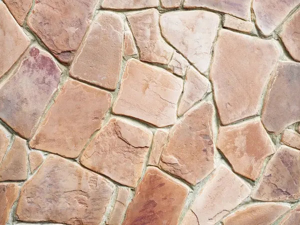 Stone wall tiles. Terracotta sandstone for cladding. Closeup background horizontal image. Not seamless texture.