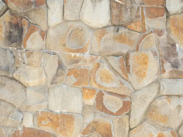 Wall cladding with coarse decorative stone. Not a seamless texture.