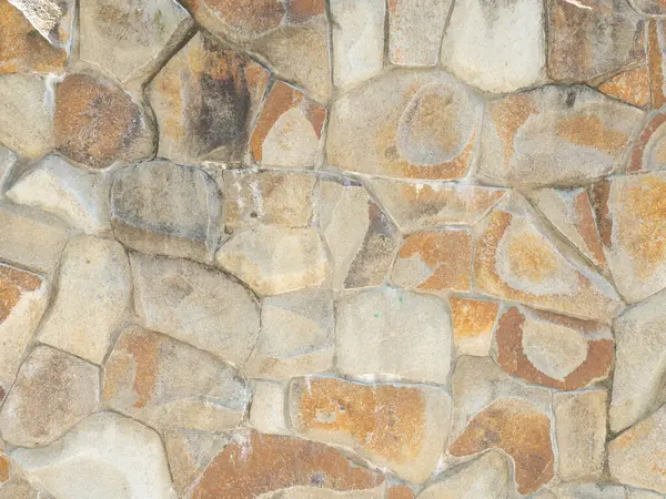 Wall cladding with coarse decorative stone. Not a seamless texture.
