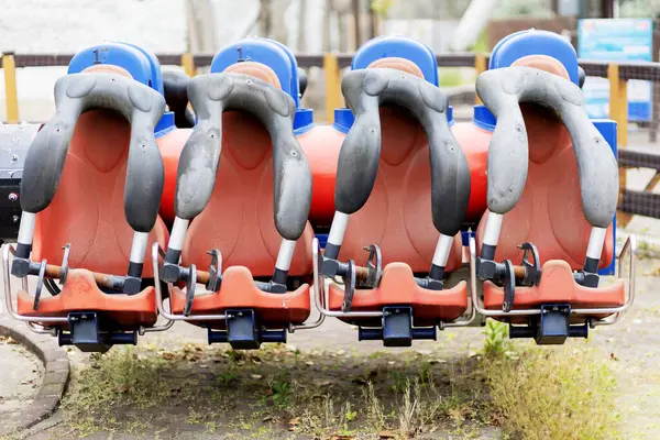 Empty seats of a non-working extreme carousel in an amusement park