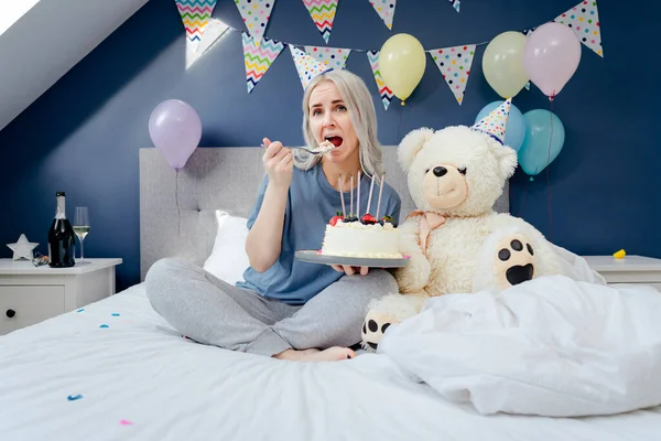 Sad Upset Woman Pajama Party Cap Eating Spoon Her Birthday —  Fotos de Stock