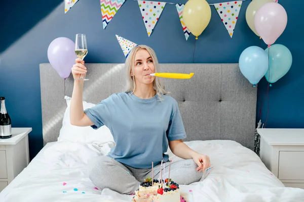 Happy Emotional Woman Pajama Party Cap Blowing Birthday Pipe While — Stockfoto