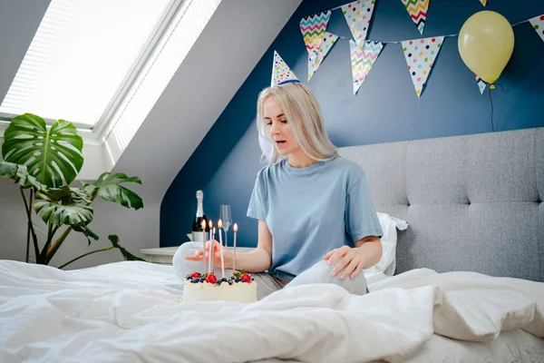 Thoughtful Woman Birthday Party Cap Festive Cake Candles Bed Decorated — стоковое фото