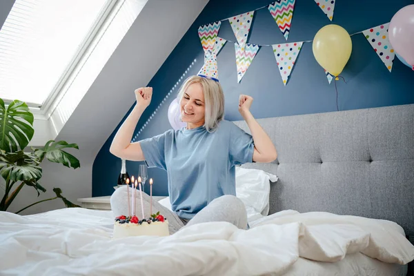 Smiling Emotional Woman Birthday Cap Festive Cake Candles Dancing Bed —  Fotos de Stock