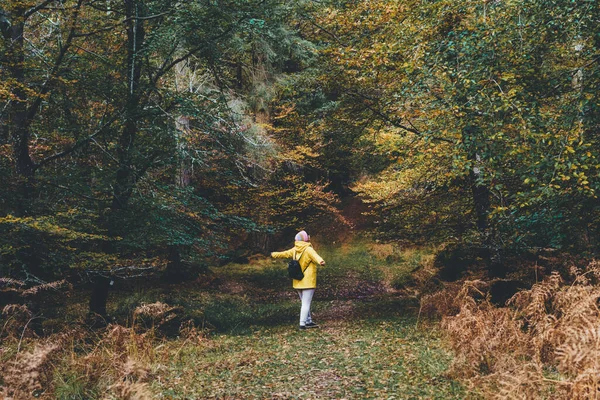 Back View Woman Raised Arms Bright Yellow Raincoat Enjoying Life — Fotografia de Stock
