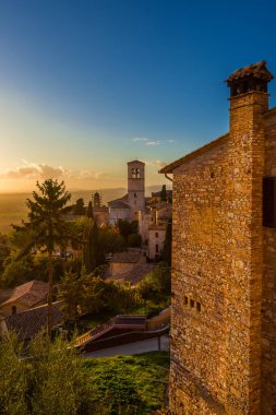 Sunset view of Assisi charming medieval historical center with Umbria countryside