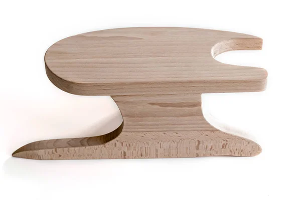 Um bloco de madeira feito de faia para passar com um ferro. Uma ferramenta para um alfaiate. — Fotografia de Stock