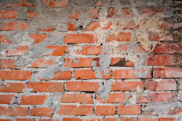 Beton harç izli tuğla duvar dokusu. Tuğla ve beton dokusu. Eski kırmızı tuğla binanın eski duvarı..